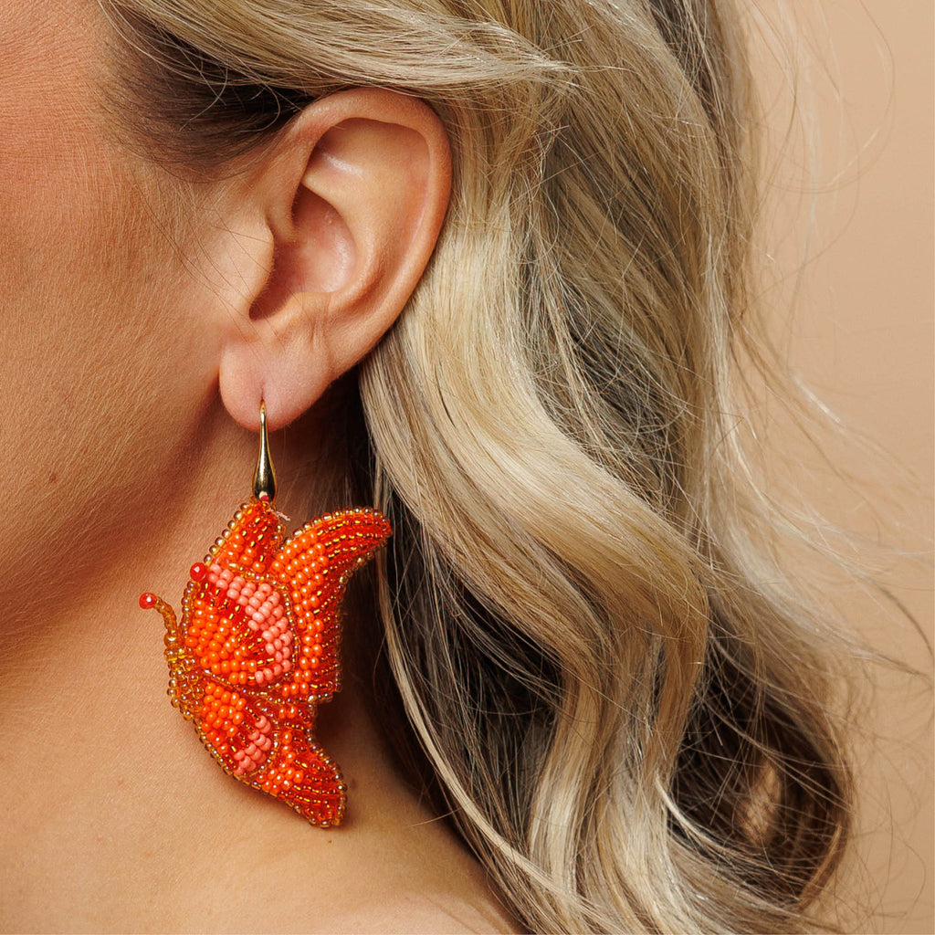 Butterfly Earrings - Orange - Model - Paulie Pocket2